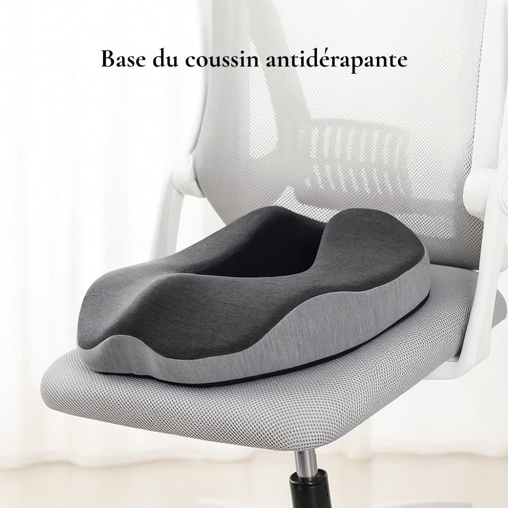 Coussin antidérapant gris foncé et clair, en forme ergonomique, posé sur une chaise de bureau moderne