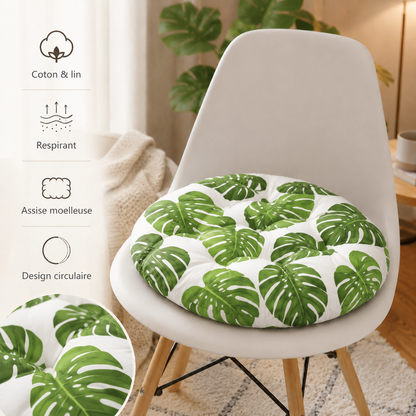Coussin de chaise rond motif feuilles vertes présenté sur une chaise avec ses caractéristiques : coton et lin, respirant, assise moelleuse et design circulaire.
