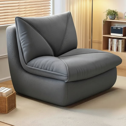 Fauteuil pouf salon en velours côtelé gris foncé dans un salon moderne
