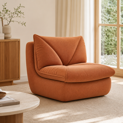 Fauteuil pouf salon en velours côtelé marron caramel dans un intérieur lumineux