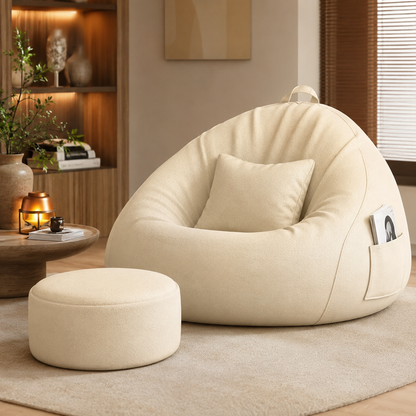 Pouf poire géant pour salon crème avec repose-pieds assorti dans un intérieur cosy