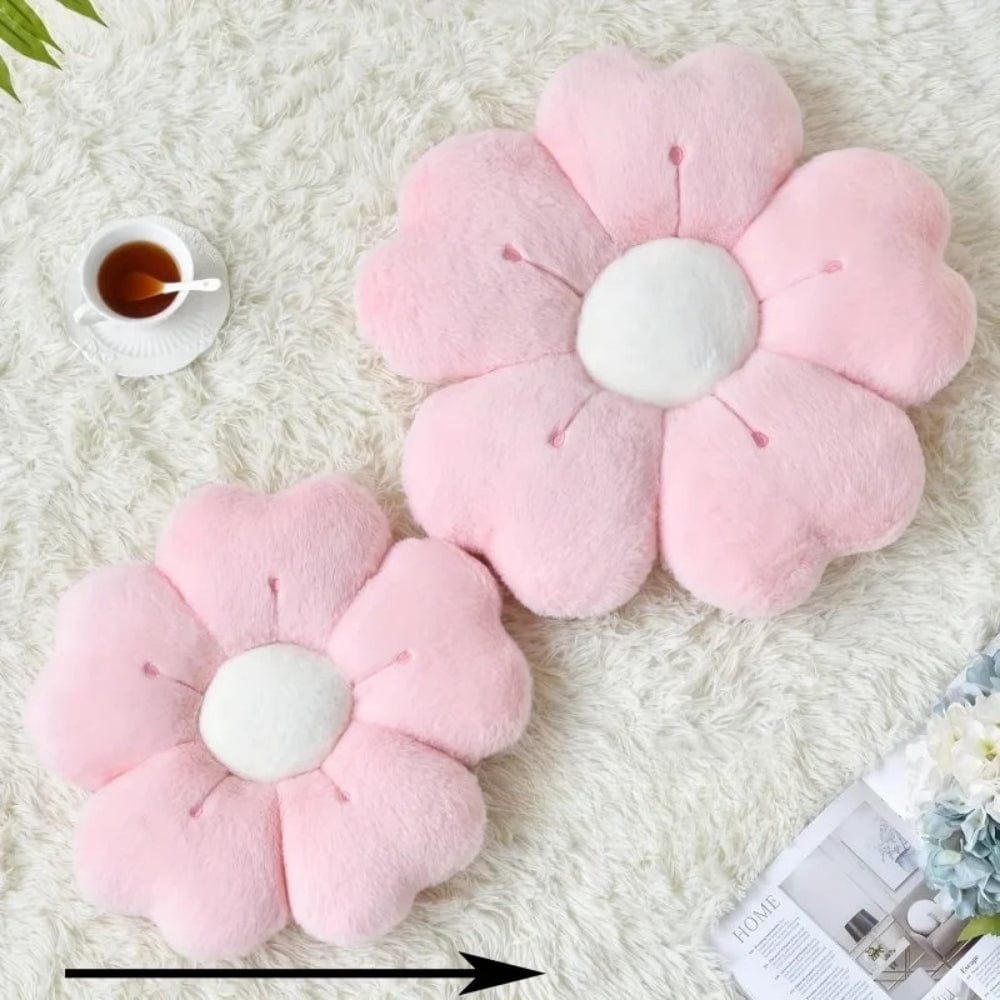 Coussins décoratifs en forme de fleurs roses sur un tapis doux, parfaits pour un canapé ou une chambre