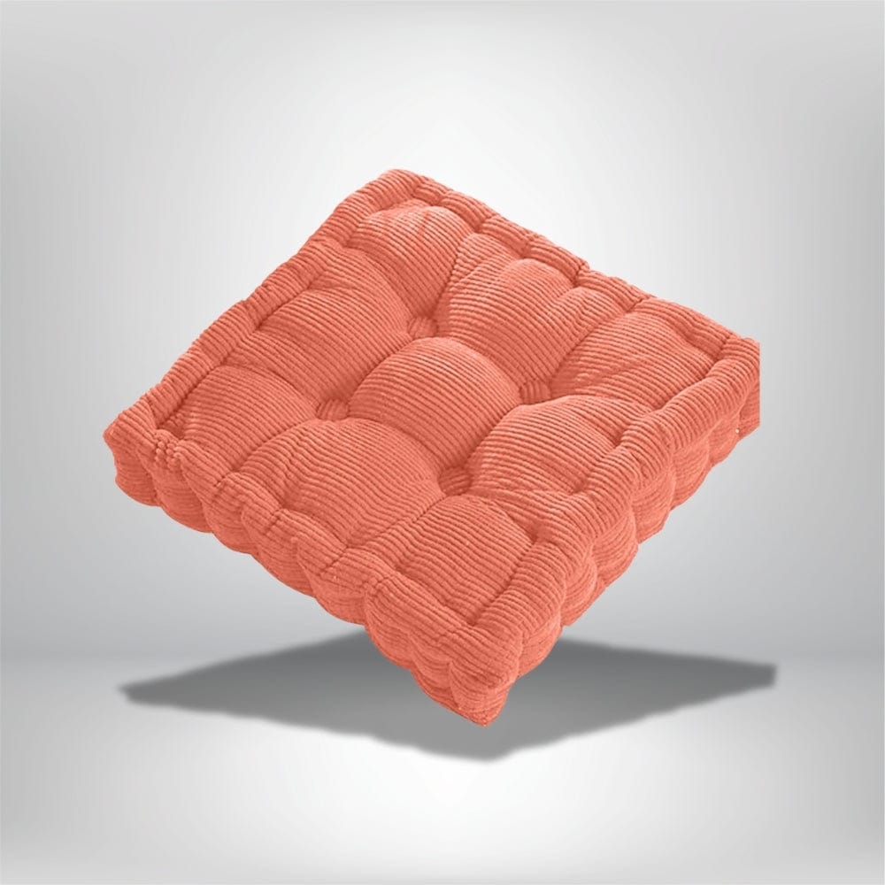 Coussin d'assise en velours côtelé orange, décoratif, posé sur un fond neutre