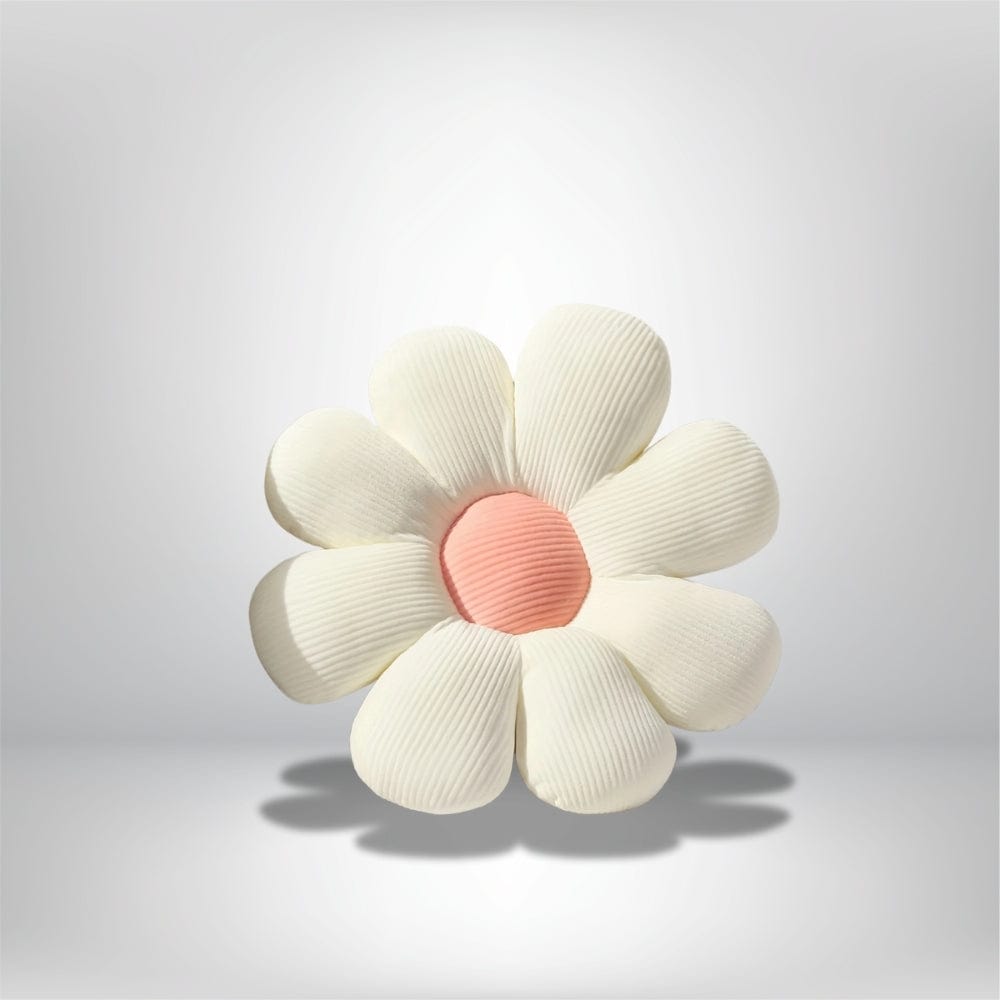 Coussin décoratif en forme de fleur blanche avec un centre rose, idéal pour une chaise intérieure
