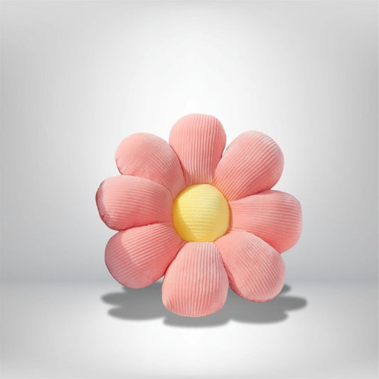 Coussin décoratif en forme de fleur avec des pétales roses et un cœur jaune, idéal pour un fauteuil