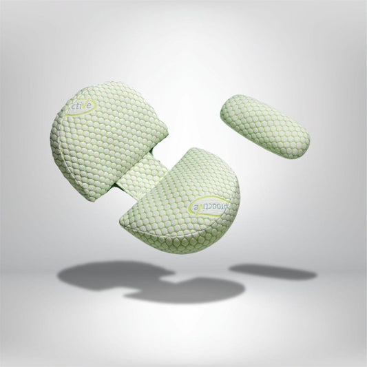 Coussin de grossesse en forme ergonomique, couleur vert pastel avec motif alvéolé, idéal pour un confort optimal