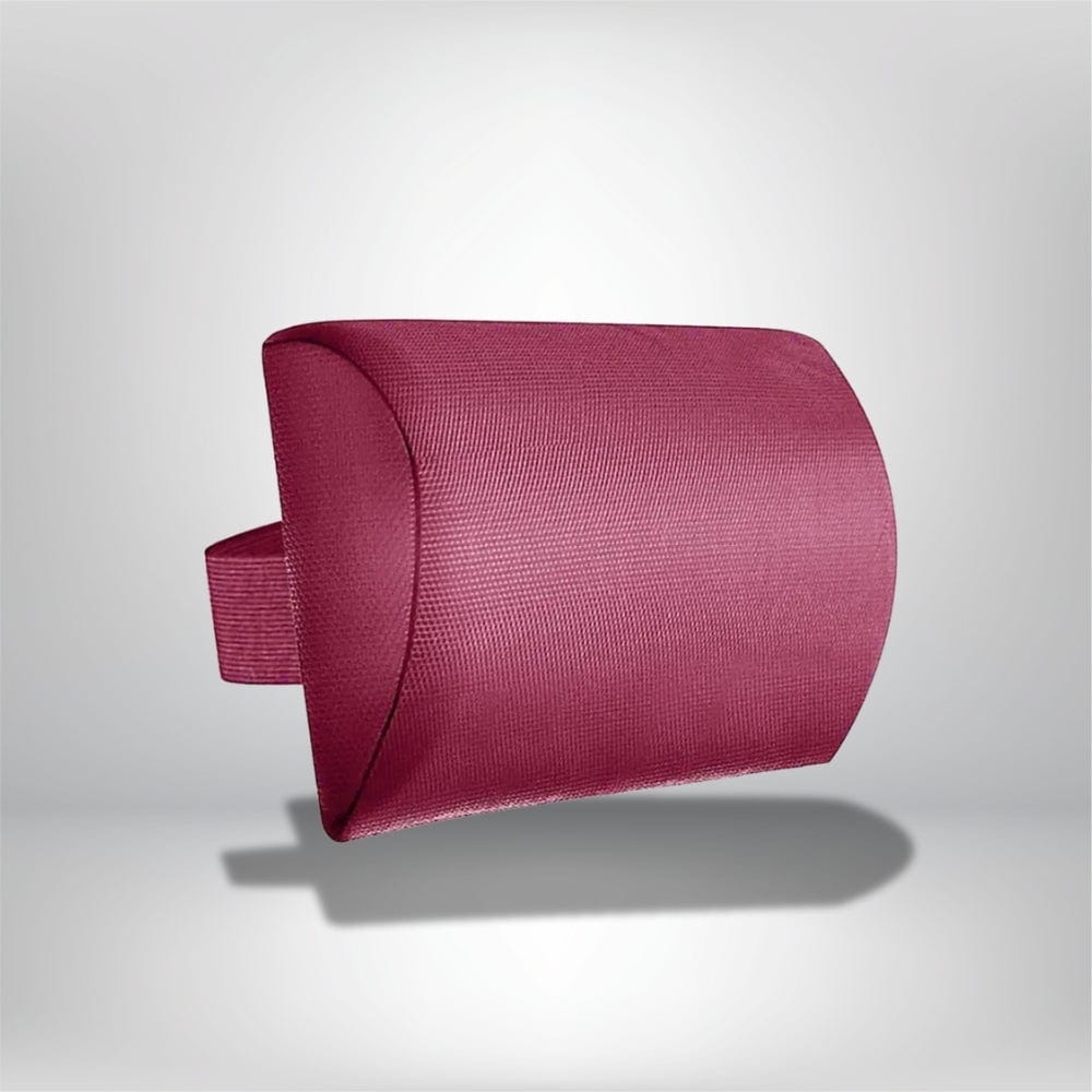 Coussin de tête en tissu texturé rose, légèrement arrondi, posé sur un fond neutre