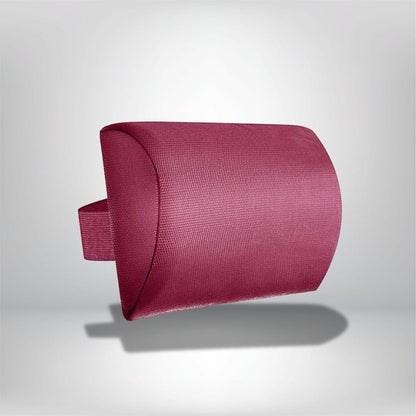 Coussin de tête en tissu texturé rose, légèrement arrondi, posé sur un fond neutre