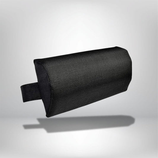 Coussin de tête noir en tissu texturé, posé sur un fond neutre, idéal pour un confort optimal