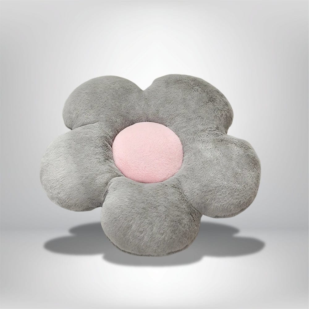 Coussin décoratif en forme de fleur, gris doux avec un centre rose, idéal pour un canapé ou une chambre