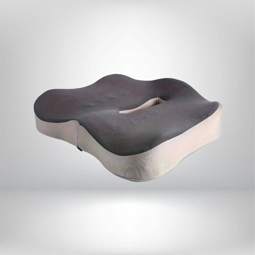 Coussin ergonomique de chaise, en mousse noire et beige, avec une forme ondulée et un creux central