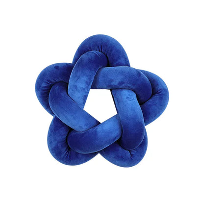 Coussin décoratif en velours bleu en forme d'étoile avec un nœud, idéal pour un canapé ou une chambre