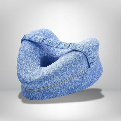 Coussin genoux en tissu bleu, forme ergonomique avec un creux, idéal pour un confort nocturne