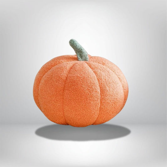 Coussin décoratif en forme de citrouille orange avec une tige verte, idéal pour un salon d'Halloween