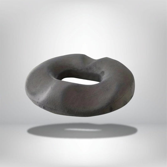Coussin décoratif noir en forme de donut, idéal pour un confort optimal sur une chaise ou un canapé