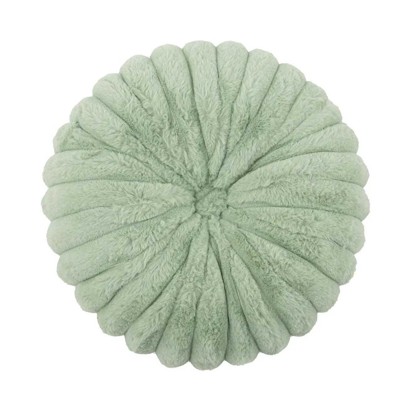 Coussin décoratif rond en velours vert doux, posé sur un canapé, ajoutant une touche de confort et d'élégance