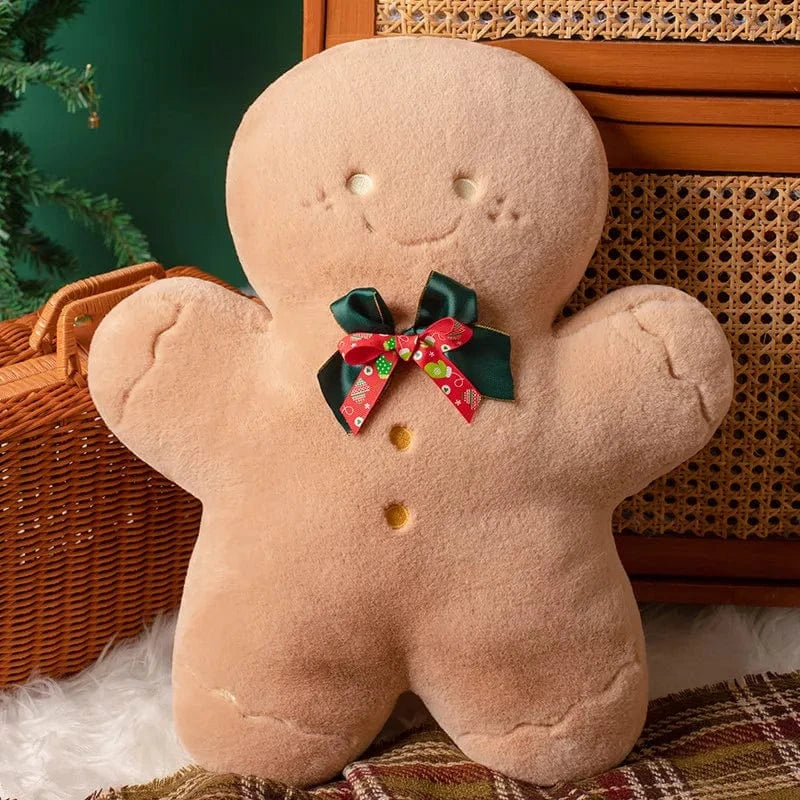 Coussin en forme de bonhomme en pain d'épice, couleur beige avec un nœud vert et rouge, décoratif pour les fêtes
