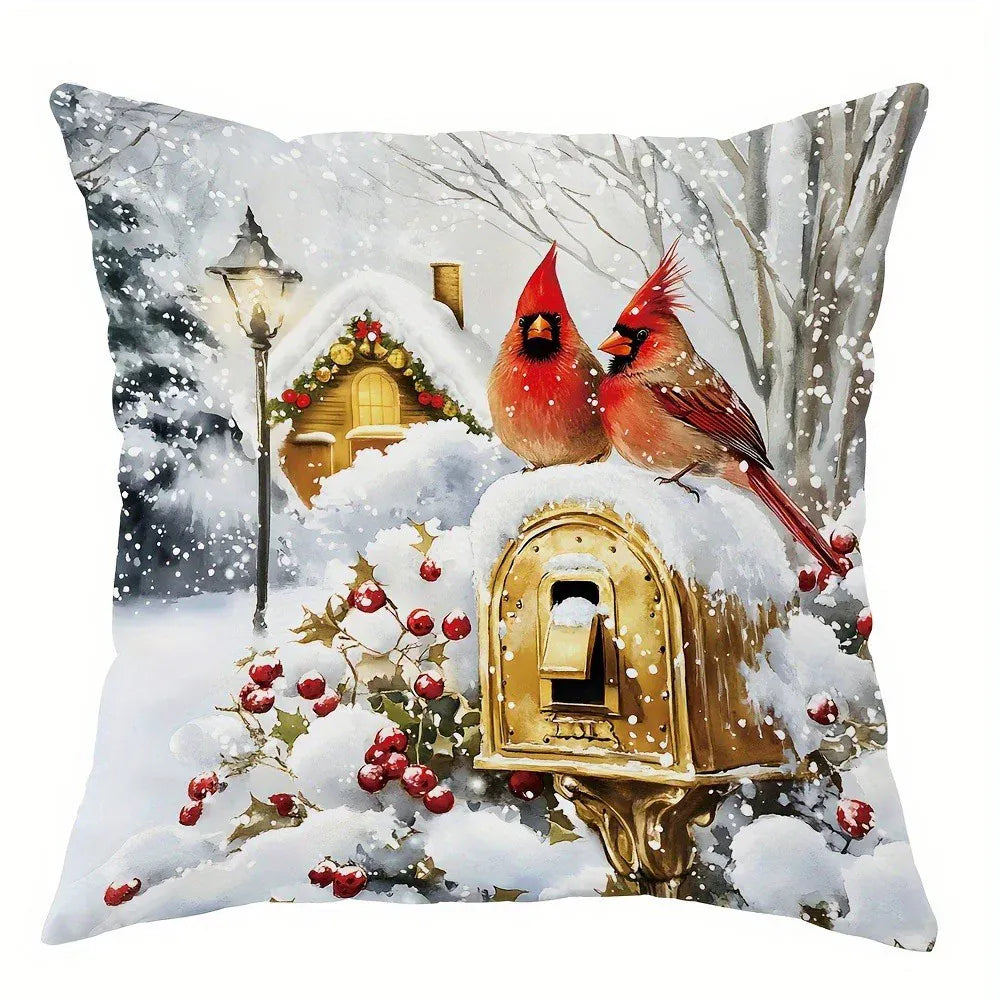 Coussin déco illustré avec des cardinaux rouges sur fond enneigé, idéal pour un salon festif
