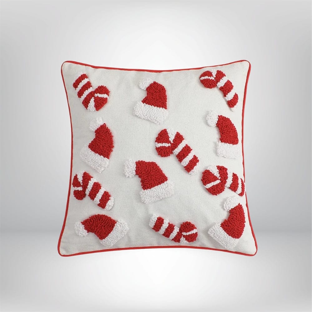 Housse de coussin décoratif blanche avec motifs de bonnets de Noël rouges et blancs, parfaite pour un canapé festif