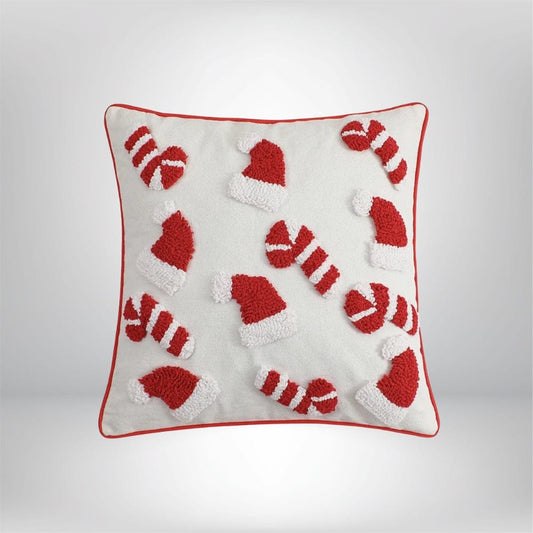 Housse de coussin décoratif blanche avec motifs de bonnets de Noël rouges et blancs, parfaite pour un canapé festif