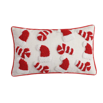 Housse de coussin décoratif avec motifs de bonnets de Noël rouges et blancs sur fond crème, idéale pour le salon