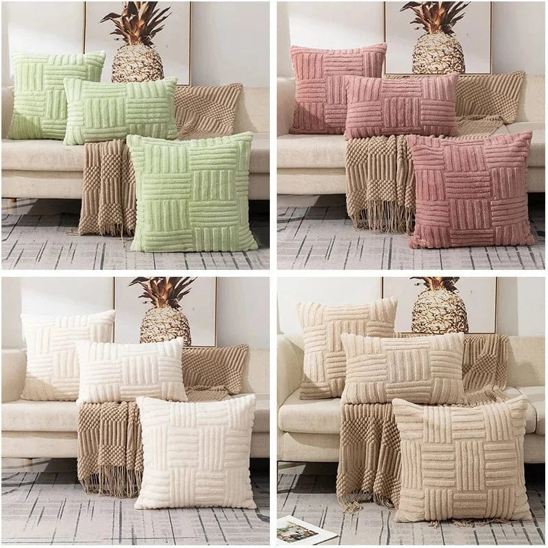 Coussins décoratifs aux teintes pastel sur un canapé, avec motifs géométriques en relief et texture douce