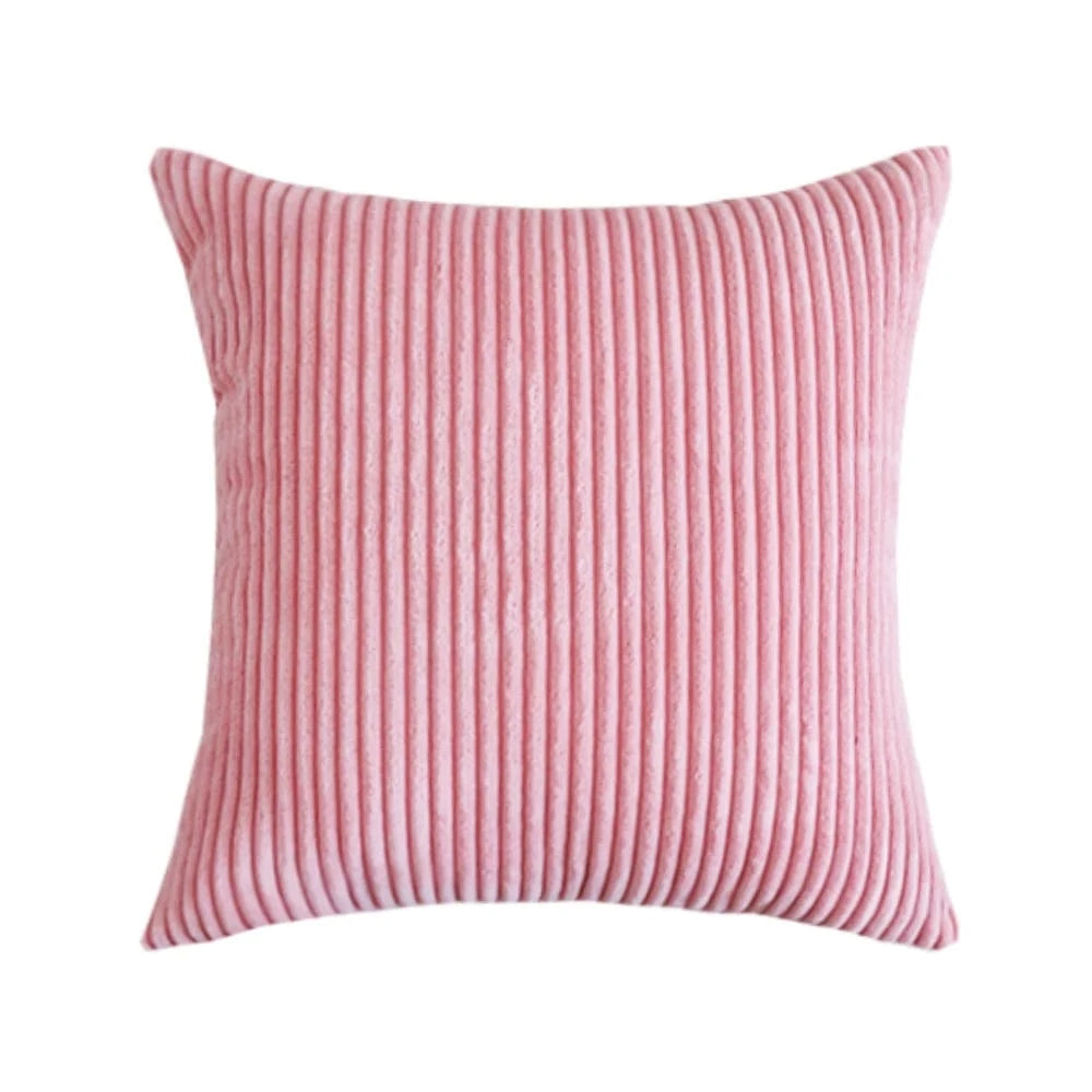 Coussin décoratif en velours côtelé rose, au design intemporel, idéal pour un canapé ou un lit élégant