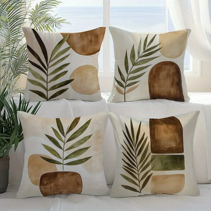 Coussins décoratifs aux motifs géométriques naturels, couleurs terre et vert, disposés sur un canapé lumineux