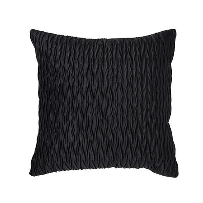 Coussin décoratif noir texturé, idéal pour un canapé moderne, ajoutant une touche élégante à votre salon
