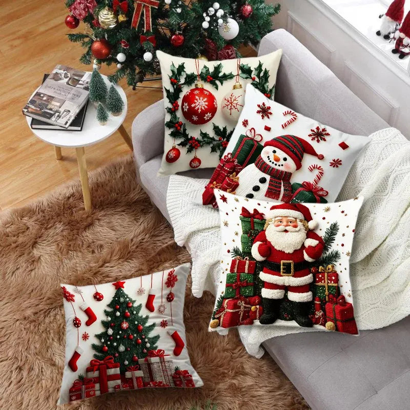 Coussins décoratifs de Noël aux motifs festifs, sur un canapé avec des couleurs rouges, vertes et blanches