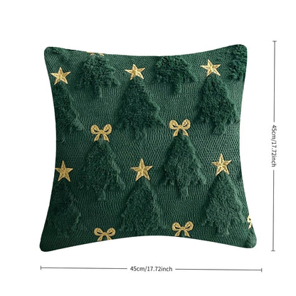 Housse de coussin vert forêt avec motifs d'arbres dorés et étoiles, parfaite pour une ambiance festive sur le canapé
