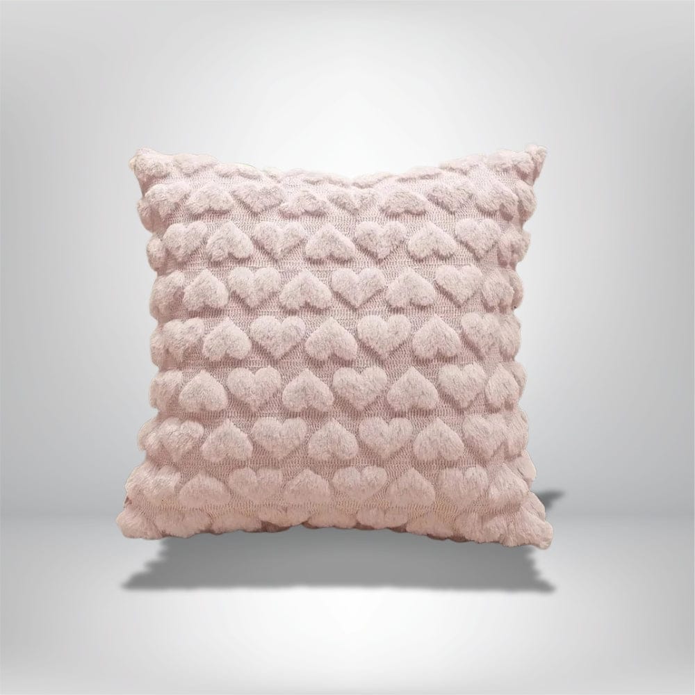 Coussin décoratif rose en forme de cœur, idéal pour un canapé ou un lit romantique