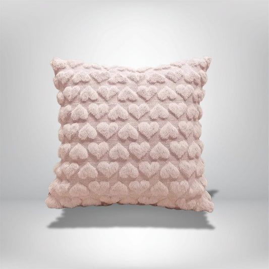 Coussin décoratif rose en forme de cœur, idéal pour un canapé ou un lit romantique