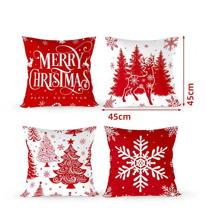Quatre housses de coussin décoratives rouges avec motifs de Noël, incluant un renne, des sapins et des flocons de neige