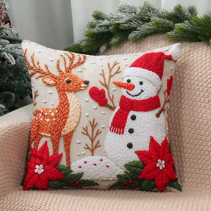 Coussin décoratif en tissu beige avec motif de renne et bonhomme de neige, idéal pour un canapé festif