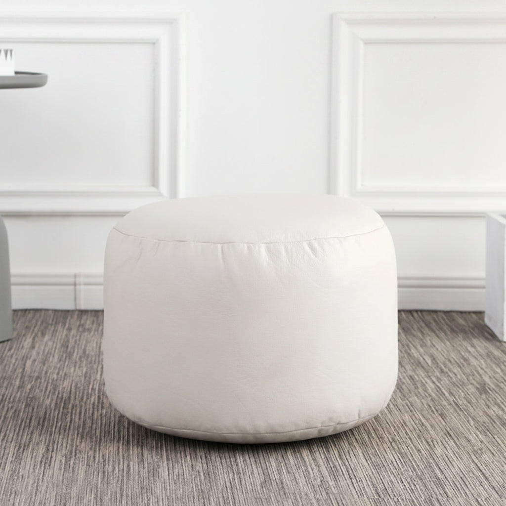 Petit pouf rond repose-pieds effet cuir blanc cassé