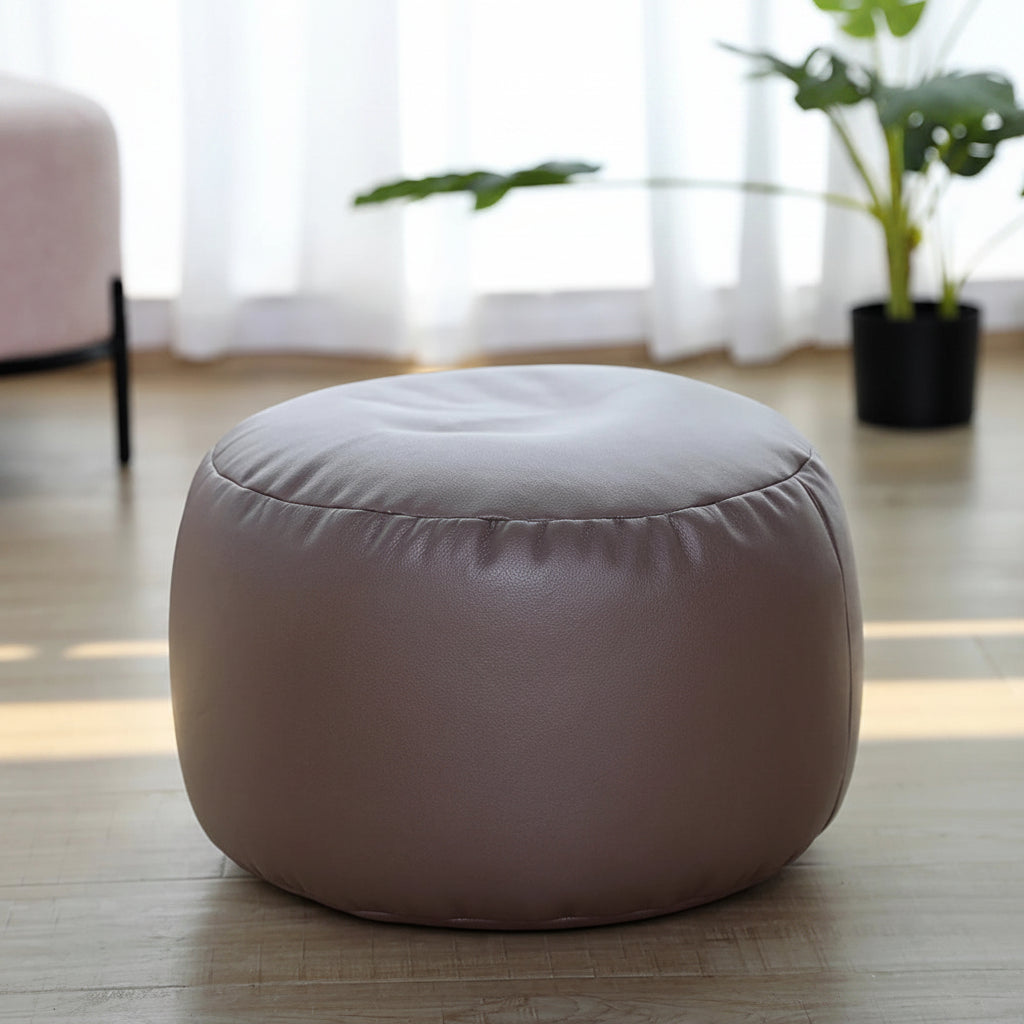 Petit pouf rond repose-pieds effet cuir taupe