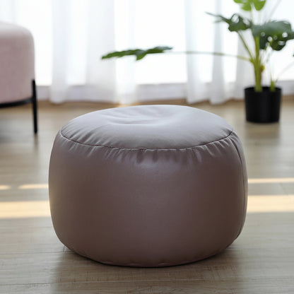 Petit pouf rond repose-pieds effet cuir taupe
