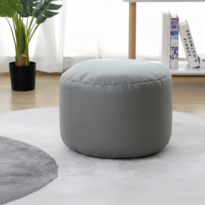 Petit pouf rond repose-pieds effet cuir vert sauge
